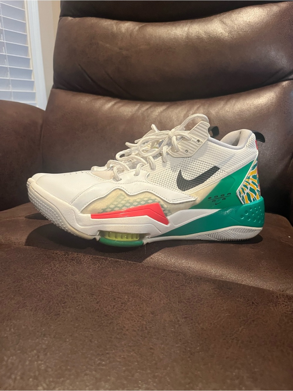 Nike Men’s Zoom Air White Basketball Sneakers with Green and Coral Accents
